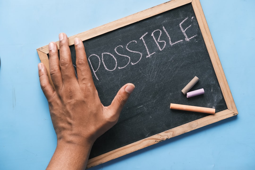 a-chalkboard-with-the-word-possible-written-on-it-jxi526yiqga